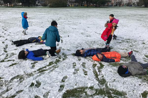 Students playing in snow