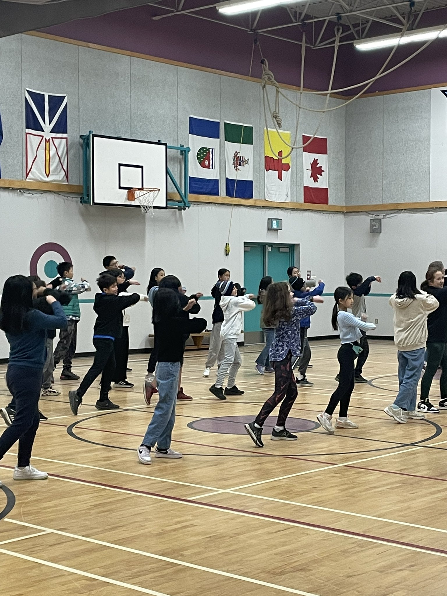 Children engaging in Bollywood dance in their school gym