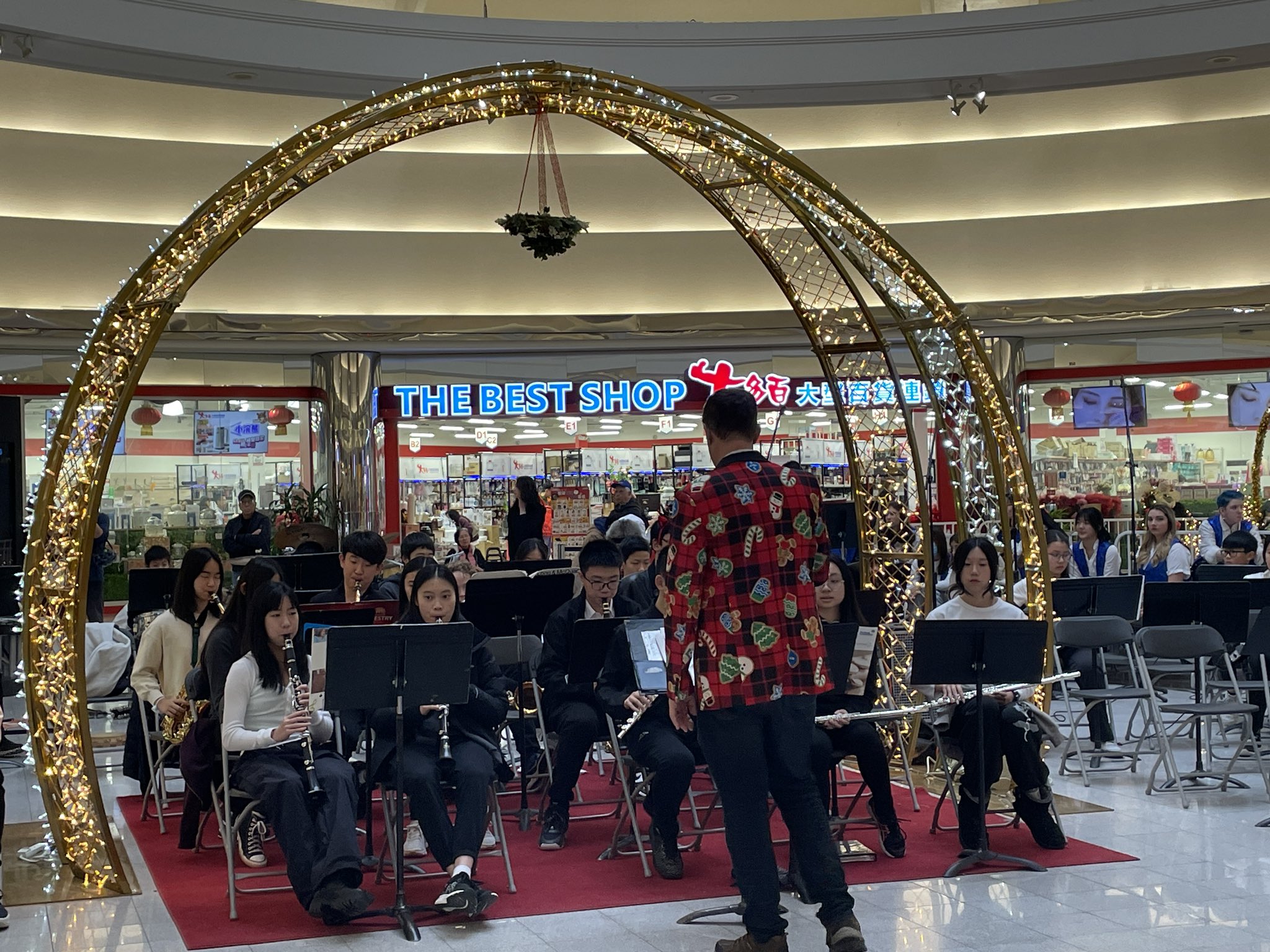 Students playing in a band concert inside a Richmond mall